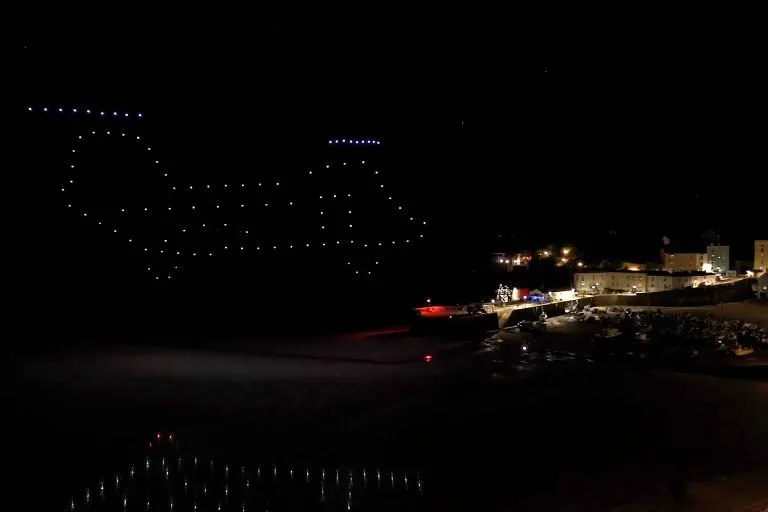 A chinook as part of the Respect The Range Drone Display